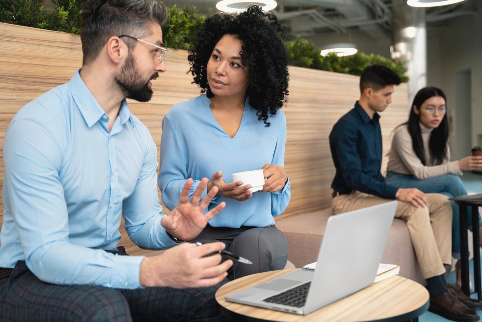 Person using budgeting platform on multiple devices including tablet and smartphone